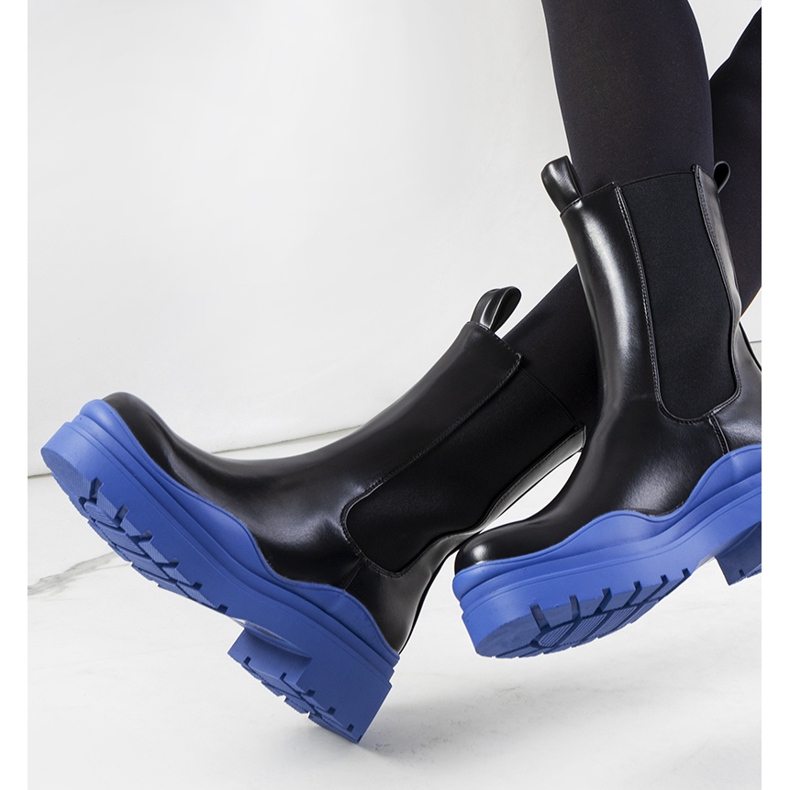 Black boots with a blue Nester sole 1