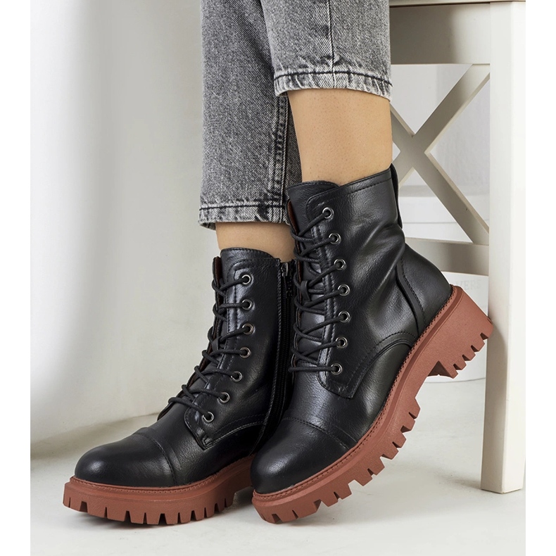 Black boots on a brown Rukit sole 1