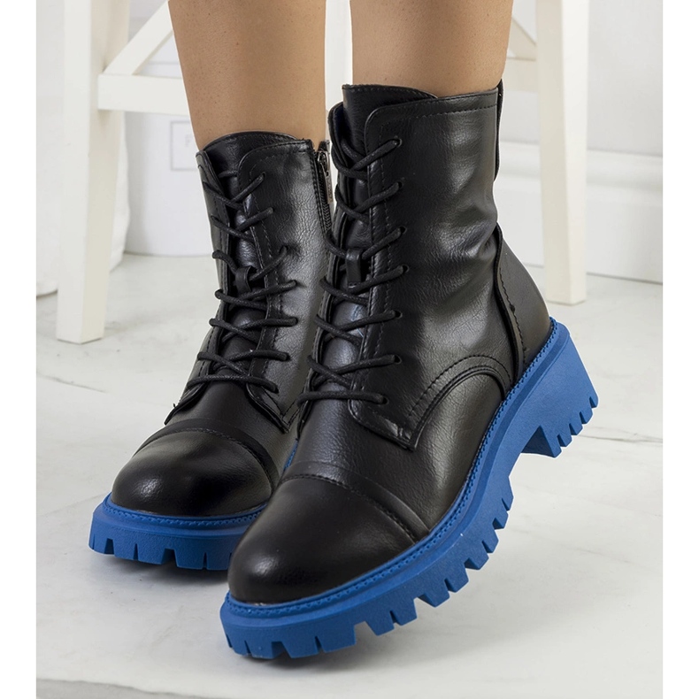 Black boots on a blue Rukit sole 1