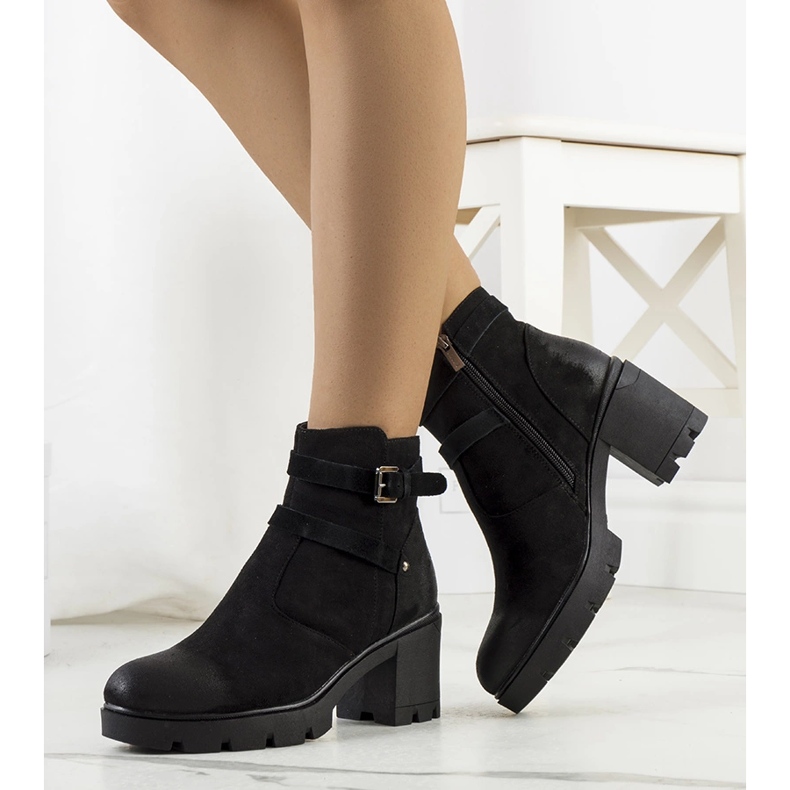 Black boots on a Lamaris tractor sole 1