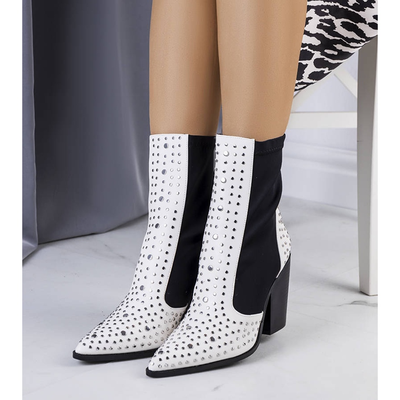 White boots decorated with Orazi studs 1
