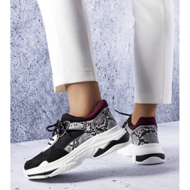 Black sneakers decorated with Savard inserts 1