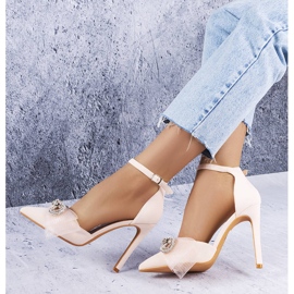 Beige pins with a bow and cubic zirconias from Bussi 1