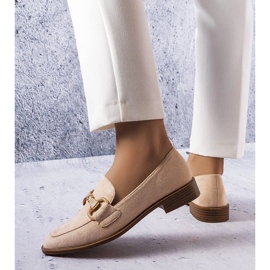 Beige loafers with a gold embellishment from Fluet 1