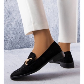 Black loafers with a gold embellishment from Fluet 1
