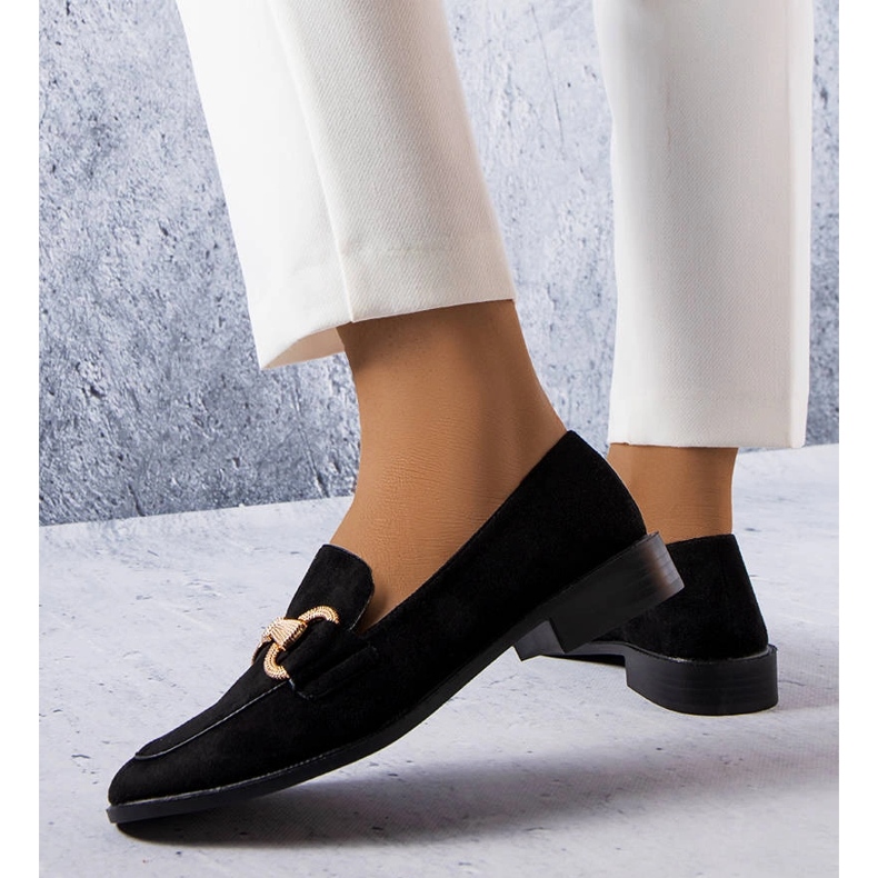 Black loafers with a gold embellishment from Fluet 1