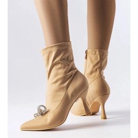 Beige boots decorated with a zircon Mars bow 1