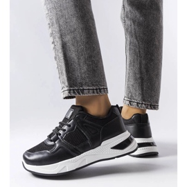 Black sneakers made of combined materials from Caya 1