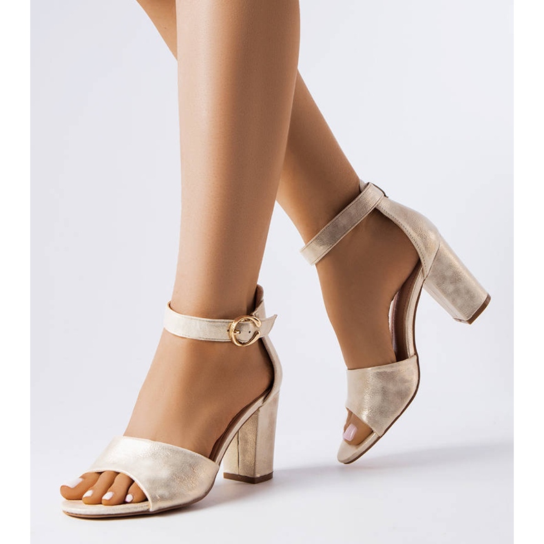 Gold sandals on the post golden 1