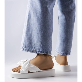 White platform sandals with a bow from Edvard 1
