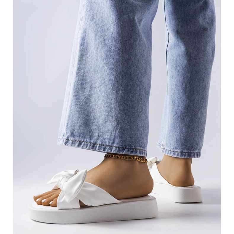 White platform sandals with a bow from Edvard 1