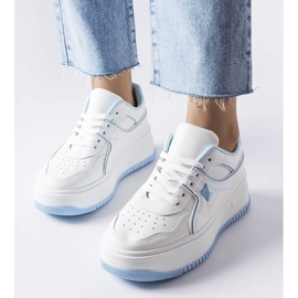 White and blue sneakers on the Lepage platform 1