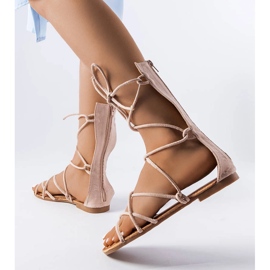 Beige high-tie sandals from Heliport 1