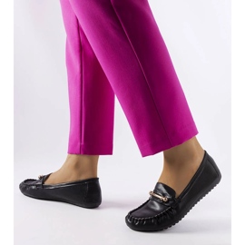 Black loafers with a matte finish from Sorel 1