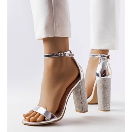 Silver sandals on a decorative Rette post 1