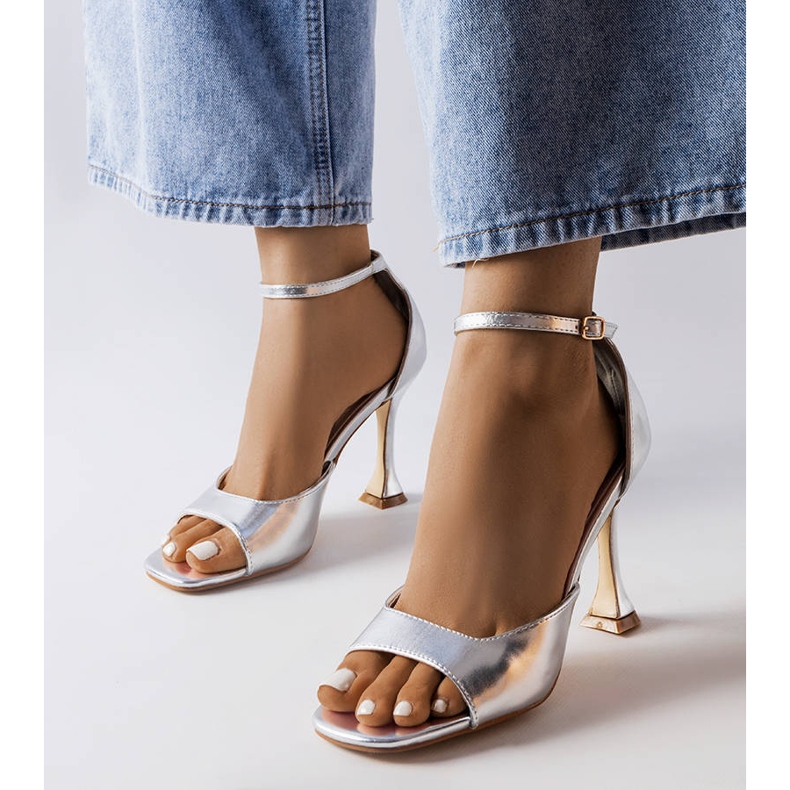 Silver heeled sandals with a strap from Delinda 1