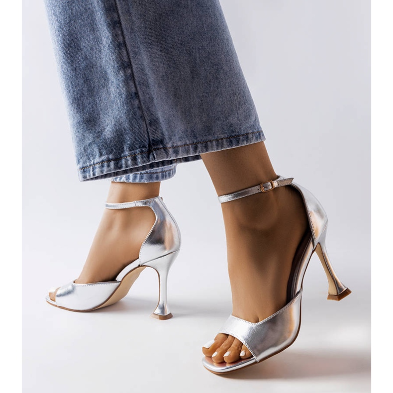 Silver heeled sandals with a strap from Delinda 2