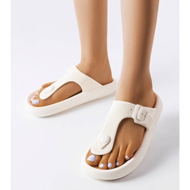 White flip flops on the Moretti platform 1