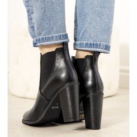 Black insulated boots on the Castro post 1