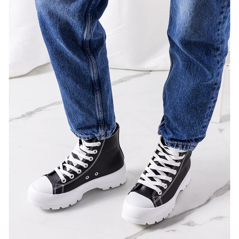 Black sneakers on the Curley platform 1