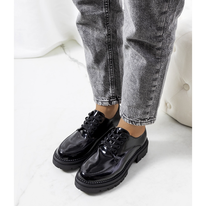 Black shoes on a tractor sole from Markus 1