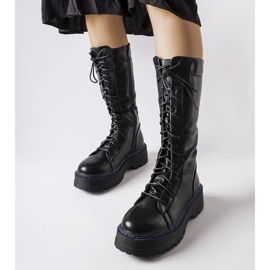 Black insulated boots on the Hide platform 1