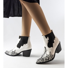 White insulated cowboy boots with a snake motif from Goulet 1