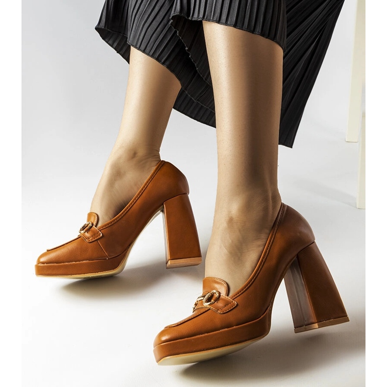 Brown pumps on a geometric block from Blaiss 1