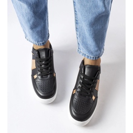 Black and gold sports sneakers from Parma 1