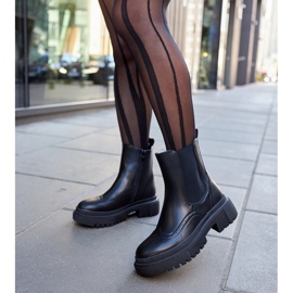 Black ankle boots decorated with Castella stitching 2