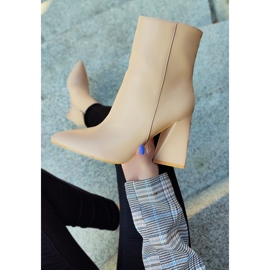 Beige ankle boots on a triangle-shaped post 2