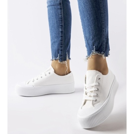 White sneakers on a thick Fortunata platform 1