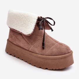 Beige Olimuka snow boots on a platform with a sheepskin coat 1