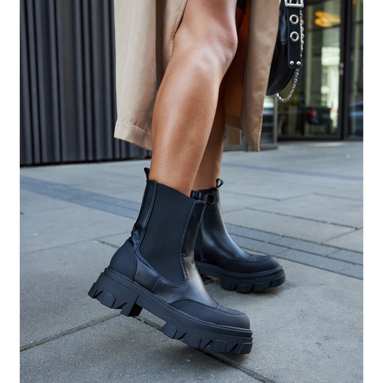 Black ankle boots with visible Moriano tread 2