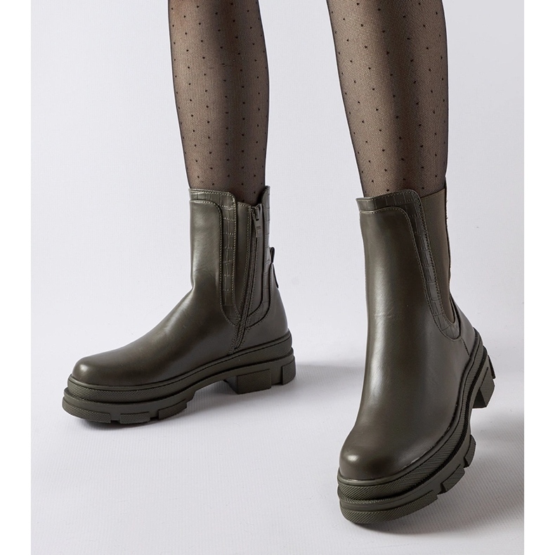 Green sneakers with a massive Torin sole 1