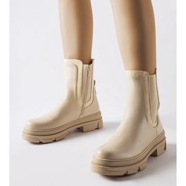 Beige sneakers with a massive Torin sole green 1