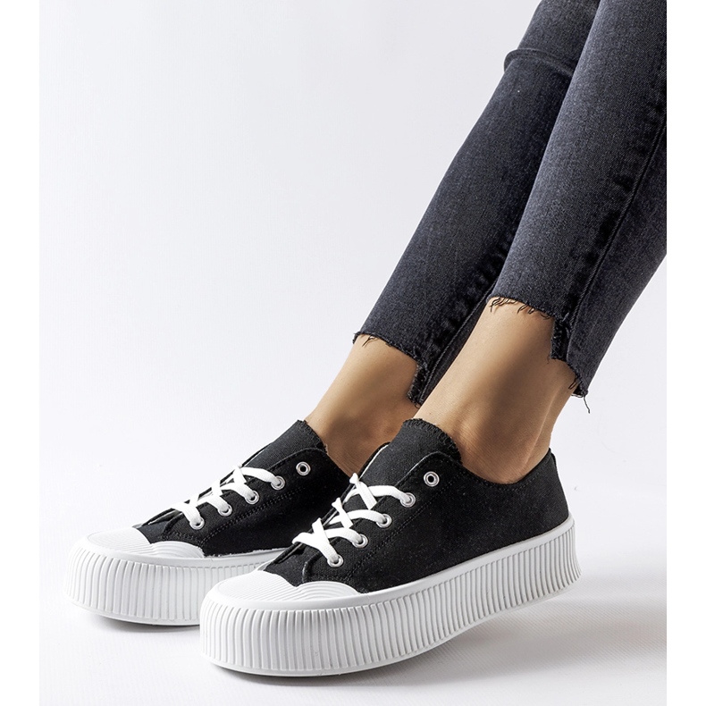 Black sneakers on a white Fortunata platform 1