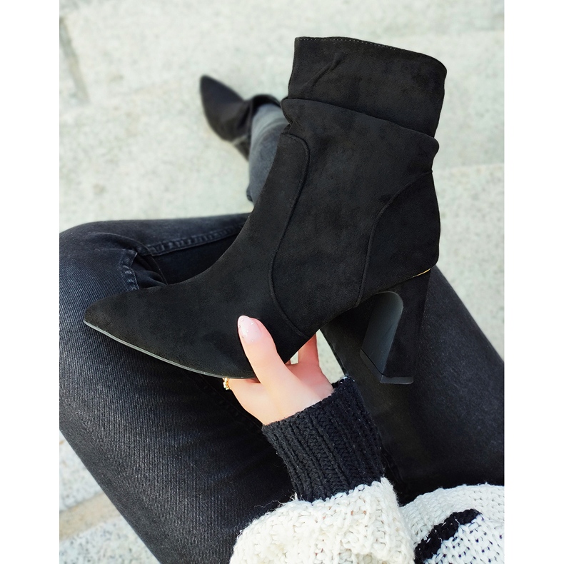 Ladies' black boots on a decorated post 2