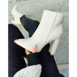 Ladies' beige boots with a decorative spike 2
