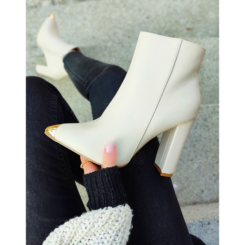 Ladies' beige boots with a decorative spike 2