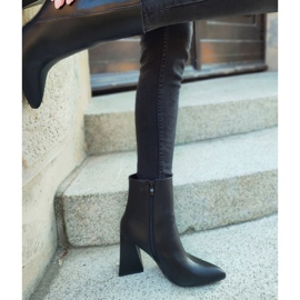 Black boots on a triangle-shaped post 2
