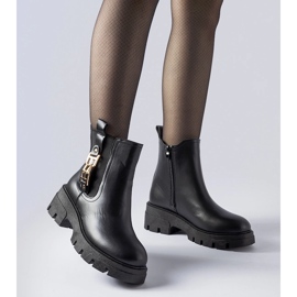 Black massive ankle boots with a decorative Nuovo buckle 1