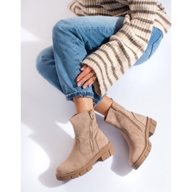 Beige suede ankle boots with a decorative zipper by Vinceza 1