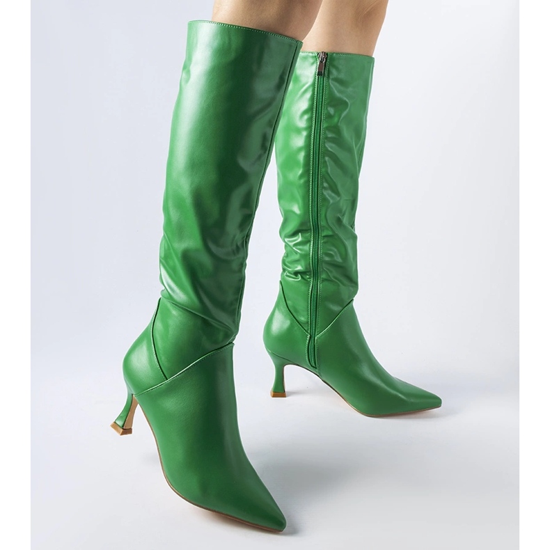 Green pointed boots with a high heel