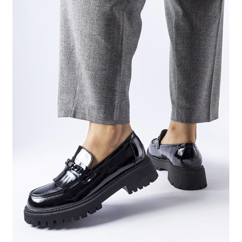 Black patent loafers with a buckle by Agordina 1