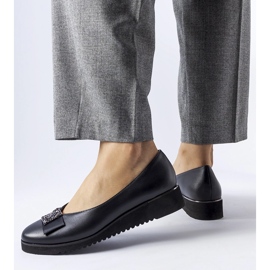 Black ballet flats with a bow on the wedge 1