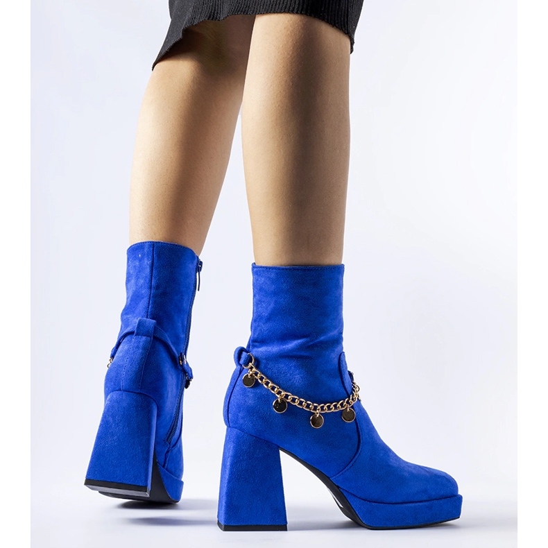 Blue insulated ankle boots with a Saviore pendant 1