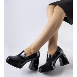 Black patent pumps with a West heel 1