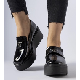 Black patent loafers with a Monra platform 1