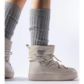 Beige patent snow boots with elastic band from Calogero 1